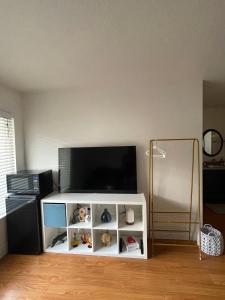 a white entertainment center with a flat screen tv at LA Lux Suite with Private Bathroom in Santa Clarita