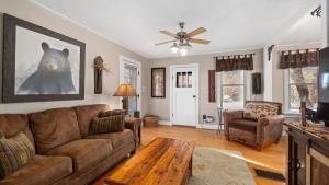a living room with a couch and a table at Beartraks in Red Lodge