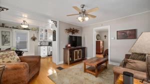 a living room with a couch and a tv at Beartraks in Red Lodge +18 photos