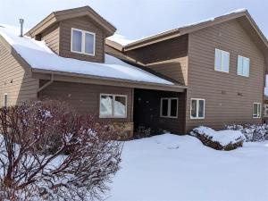 a house with snow in front of it at Putter`s Inn in Red Lodge