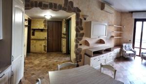 a kitchen with a table and chairs and a kitchen with at Residence Future in Cologno Monzese