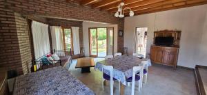 a living room with a table and a couch at Chalet Nuevo Amanecer in Merlo