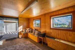 a room with a bench and a window at Blackwood Lakeview Retreat in Queenstown