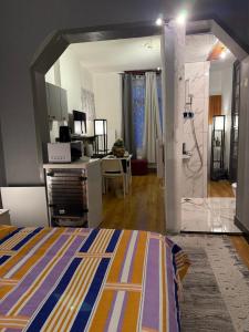 a bedroom with a bed and a room with a bathroom at Fly City châtelet in Châtelet
