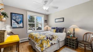 a bedroom with a bed and a window at Alpine Adventure in Red Lodge +39 photos