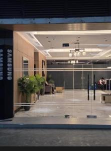 a lobby with glass doors and potted plants in a building at Jtower Residences Rad Staycation in SM Jmall in Mandaue City +95 photos