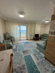 a living room with a couch and a table at Classic Seaview in Alexandria