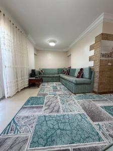 a living room with a couch and a rug at Classic Seaview in Alexandria