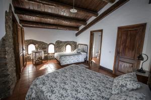 Postel nebo postele na pokoji v ubytování Casa Parramon
