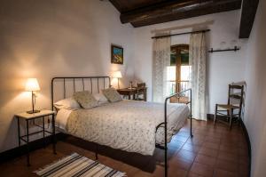 Postel nebo postele na pokoji v ubytování Casa Parramon