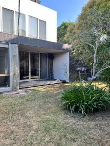 a house with a garden in front of it at Urara Holiday in Sumoto