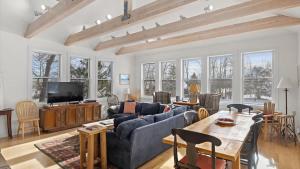 a living room with a couch and a table at Mountain Treetop in Red Lodge