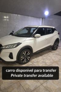 a white toyota fortuner car parked in a garage at Casa compartilhada com Quarto e Suite no Parque 10 in Manaus +2 photos