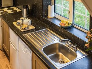 a kitchen with a sink and a counter top at Yarlington Mill in Ledbury