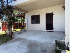 an empty parking lot in front of a house at Athaliah Stays in Suva