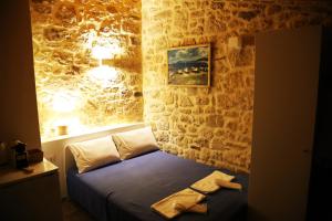 A bed or beds in a room at Matala Caves
