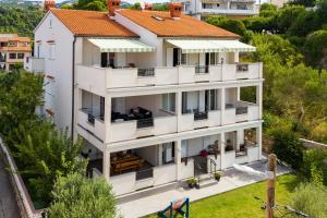 an aerial view of a white building with an orange roof at Double Room Palit 5044b in Rab