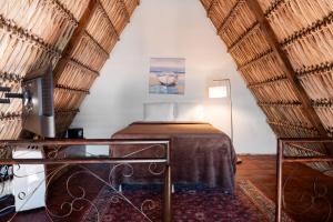 a bedroom with a bed and a tv in a room at Hotel y Restaurante Buganvilias in Las Aradas +84 photos