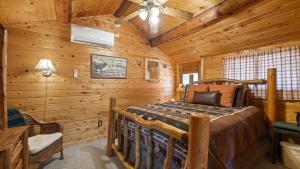 a bedroom with a bed in a log cabin at Wild Bills Cabin in Red Lodge +19 photos