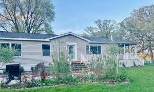 a house with a garden in the yard at Legacy Lakehouse in Spicer