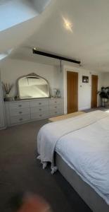 a bedroom with a bed and a tv on the wall at Layla Grove in Grove Park +6 photos