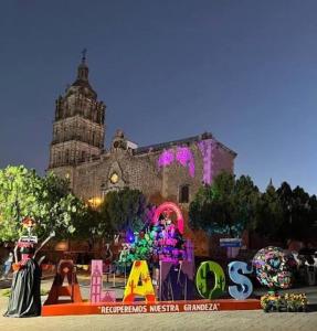 a large building with a sign in front of it at Glamping in Pueblo Magico Alamos Sonora in Álamos