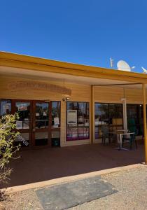 a library building with a sign that readsancy houses at Cadney Park Accommodation in Coober Pedy