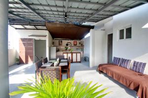a living room with a couch and a table at ILA Apartelle Boracay in Boracay