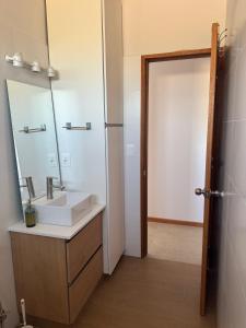 a bathroom with a sink and a mirror at Refugio del Indalo in Termas de Guaviyú