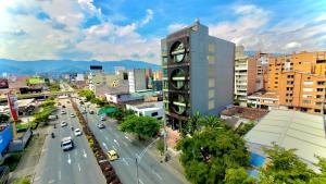 a clock tower in the middle of a city at Iconik Hotel in Medellín