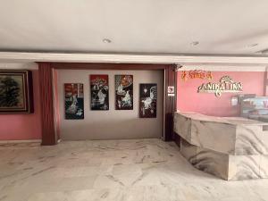 a room with pictures on the walls of a store at Anika Inn Kluang in Kluang +42 photos
