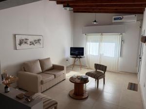 a living room with a couch and a table at Doña Mercedes in Verónica