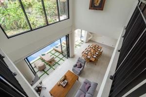 an overhead view of a living room with chairs and a table at Zen Villa - Central Canggu in Canggu
