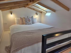 a bedroom with a large bed in a attic at BIG4 Sale Caravan Park in Sale