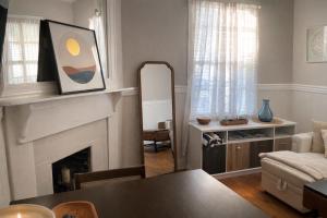 a living room with a fireplace and a table at Relaxing Poolside Condo in Savannah