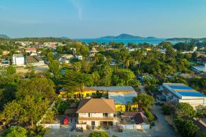 an aerial view of a small town with trees at Tongtong Garden Holiday Hotel普吉岛通通花园酒店 in Rawai Beach