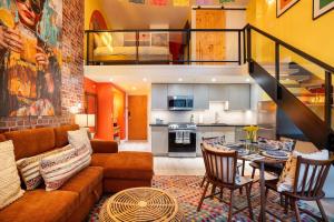 a living room with a couch and a table at Casa DT Vancouver - Mexican Theme in Vancouver