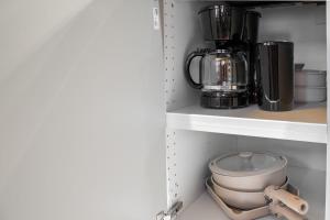a kitchen shelf with a blender and a mixer at Casa DT Vancouver - Mexican Theme in Vancouver +69 photos