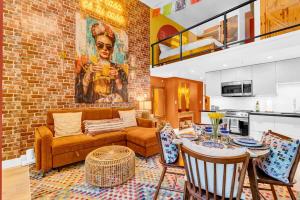 a living room with a couch and a table with chairs at Casa DT Vancouver - Mexican Theme in Vancouver