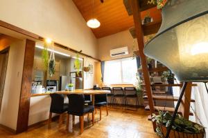 a kitchen and dining room with a table and chairs at Villa Hello Fujisan ヴィラハローフジサン 屋根付きBBQ場 ワンちゃん大歓迎 A220 in Fujiyoshida +54 photos