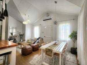 a living room with a table and a couch at Soak Screen Urban Hideaway in Iloilo City