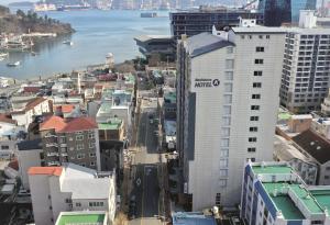an aerial view of a city with a large building at Residence Hotel K Okpo in Geoje