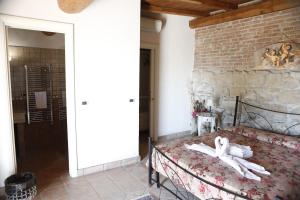 Postel nebo postele na pokoji v ubytování Il Borgo Ariccia Resort