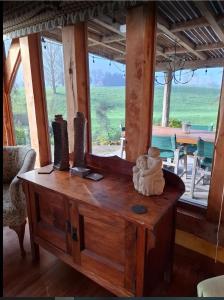 a wooden table with a teddy bear on top of it at Streamside Country Manor- Matamata in Matamata