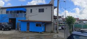 a blue and white building on the side of a street at YaNuYaNu Appartment Nabua in Suva