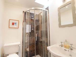 a bathroom with a shower and a toilet and a sink at Inshcraig in Kincraig +26 photos