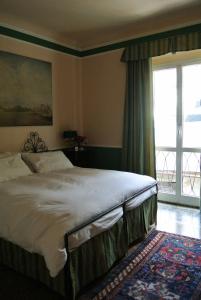 Postel nebo postele na pokoji v ubytování Palazzo Zecchino B&B