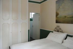 Postel nebo postele na pokoji v ubytování Palazzo Zecchino B&B