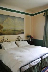 Postel nebo postele na pokoji v ubytování Palazzo Zecchino B&B