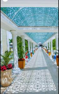 a corridor of a building with a blue ceiling at DIANA Seaside Holiday in Olimp